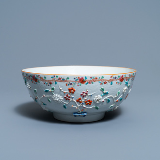 A Chinese famille rose relief-decorated floral bowl, Yongzheng/Qianlong