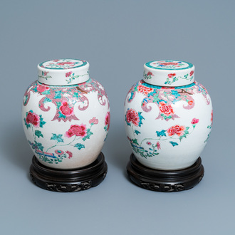 A pair of Chinese famille rose jars and covers with floral design, Qianlong