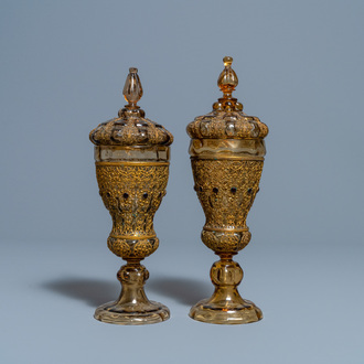 A pair of Russian or Eastern-European gilt copper and glass-inlaid glass goblets and covers, 19th C.