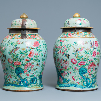 A pair of large Chinese Canton famille rose celadon-ground vases and covers, 19th C.