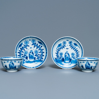 A pair of Chinese blue and white 'Caritas' cups and saucers, Kangxi/Yongzheng