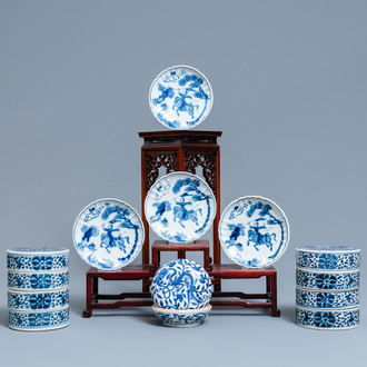 A pair of Chinese blue and white three-tier stacking boxes, a seal paste box and four saucers, 19th C.