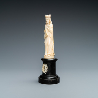 An ivory figure of a female saint holding a book, 19th C.