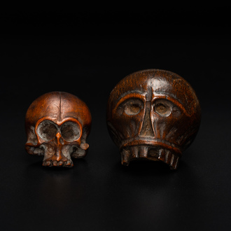 Two wooden memento mori skulls, 17/18th C.