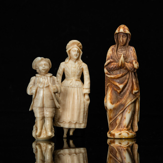 Three ivory figures of a Madonna, a fish seller and a young lad, a.o. Dieppe, France, 18/19th C.