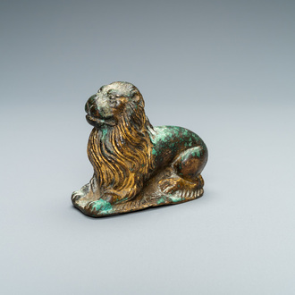 A gilt-bronze model of a recumbent lion, France, 14th C.