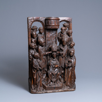 A fine oak group depicting the coronation of a bishop, North of France, ca. 1500