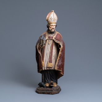 Een grote gepolychromeerde houten figuur van Sint-Amand, 17e eeuw