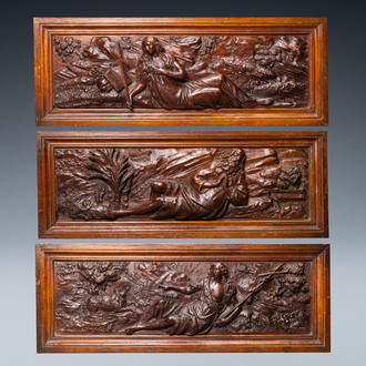 Three walnut deep-relief panels depicting Mary Magdalen, David the shepherd and Elijah in the desert, Italy, 17th C.