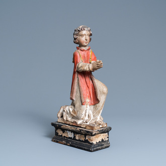 Een gepolychromeerde houten figuur van een biddende engel, ca. 1500