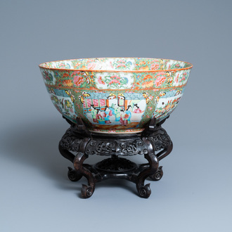 A large Chinese Canton famille rose bowl on wooden stand, 19th C.