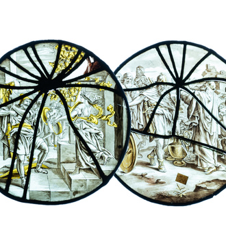 A pair of grisaille and silver yellow painted glass roundels with biblical scenes, France, 17th C.