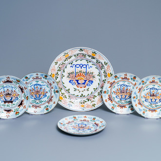 Five polychrome Dutch Delft plates and a dish with flower baskets, 18th C.