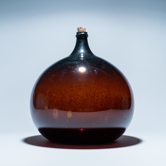 A large brown glass bottle, 18th C.