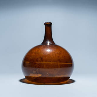 A brown glass bottle, 18th C.