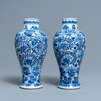 A pair of Chinese blue and white vases with floral design, Kangxi