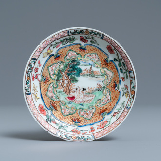 A Chinese famille rose 'erotical subject' saucer, Yongzheng