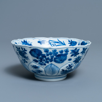 A Chinese blue and white lotus-molded bowl with floral design, Kangxi mark and of the period