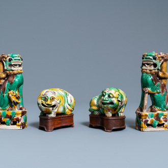 A pair of Chinese sancai models of dogs and a pair of 'Buddhist lions' joss stick holders, Kangxi