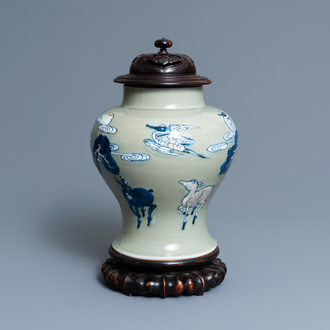 A Chinese blue, white and copper-red celadon-ground 'birds and deer' vase, Kangxi