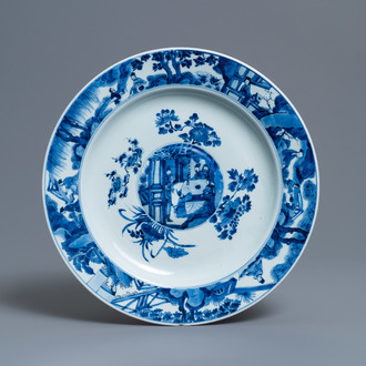 A Chinese blue and white dish with raised central medallion, Kangxi