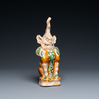 A Chinese sancai-glazed pottery 'earth spirit' figure, Tang