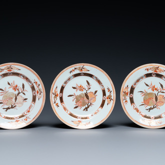 Three Chinese iron-red and gilt 'pomegranate' plates, Yongzheng