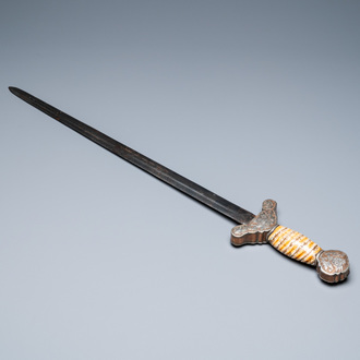 A Tibetan steel sword with silvered copper and mammoth tooth hilt, 19th C.