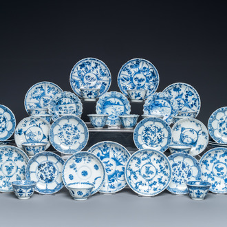 Twenty-three Chinese blue and white saucers and seventeen cups, Kangxi