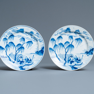 A pair of Chinese blue and white plates with a boat near the shore, Chenghua mark, Kangxi