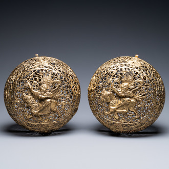 A pair of reticulated Tibetan copper incense balls, 17/18th C.