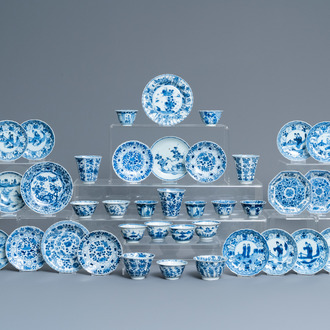 Twenty-one Chinese blue and white saucers and eighteen cups, Kangxi