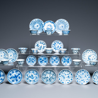 Nineteen Chinese blue and white saucers and twelve cups, Kangxi