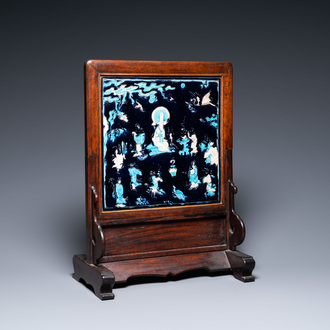 A Chinese square fahua plaque mounted in a wooden table screen, Ming