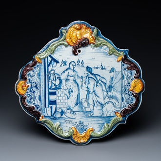 Une plaque en faïence de Delft de technique mixte à sujet religieux en bleu et blanc, 18ème