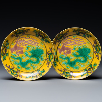 A pair of Chinese yellow-ground turquoise- and aubergine-glazed 'dragon and phoenix' plates, Qianlong mark, 19/20th C.