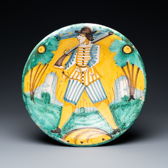 A polychrome Italian maiolica 'soldier' dish, Montelupo, 17th C.