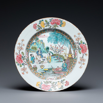 A Chinese famille rose dish with pipe-smoking fishers along the water, Yongzheng