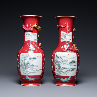 A pair of Chinese famille rose ruby-ground vases, 19th C.