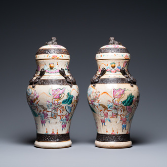 A pair of Chinese famille rose Nanking crackle-glazed vases and covers, Chenghua mark, 19th C.