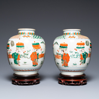 A pair of Chinese famille verte vases on wooden stands, 'hare' mark, 19th C.