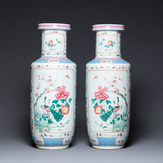 A pair of Chinese famille rose rouleau vases, 19th C.