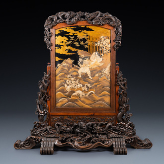 A large Japanese wooden screen with a central gilt-lacquered and ivory-inlaid panel, Meiji