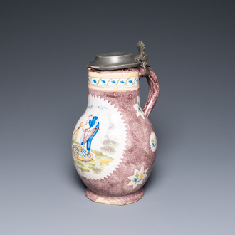 A polychrome Brussels faience ewer with a wheelwright, 18th C.