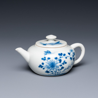 A small Chinese blue and white teapot with floral design, 19th C.