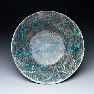 A turquoise- and black-glazed bowl, Kashan, Iran, 12/13th C.