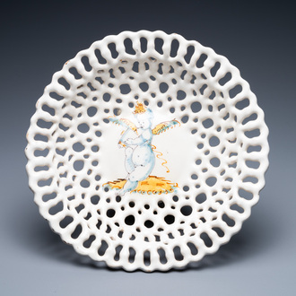 A reticulated Italian blue, white and yellow 'putto' tazza, Faenza, 17th C.