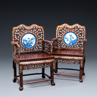 A pair of Chinese mother-of-pearl-inlaid wooden chairs with blue and white porcelain plaques, 19th C.