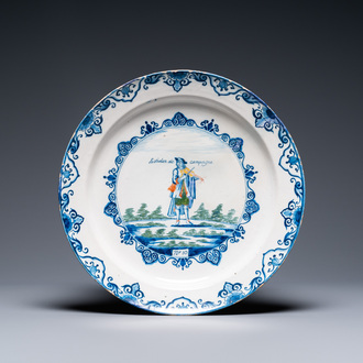 A polychrome Dutch Delft charger with a violinist, 1st half 18th C.