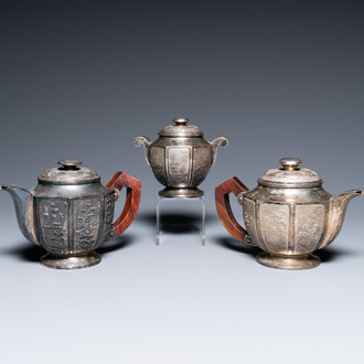 Two Vietnamese silver teapots and a sugar bowl and cover, marked Donghung, ca. 1900